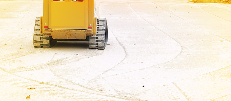 construction equipment tracks in the dirt