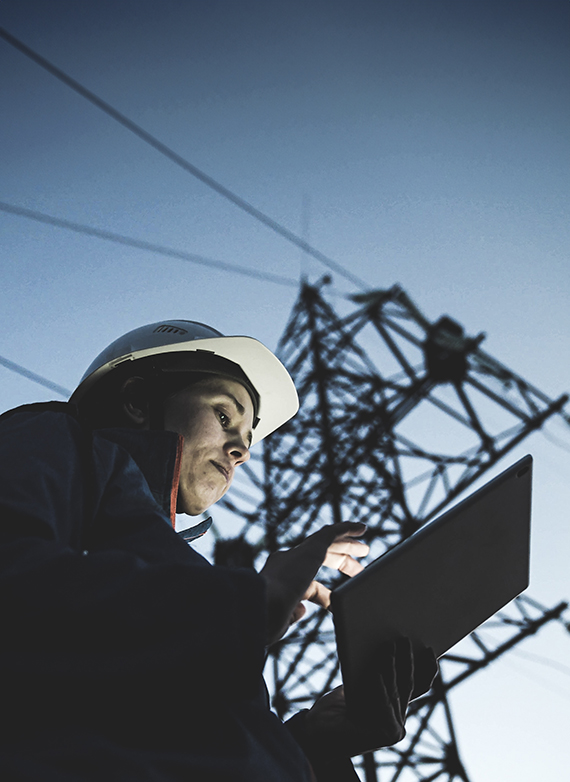 colorado-contractor-reviewing-a-job-costing-report-on-a-tablet-at-a-jobsite
